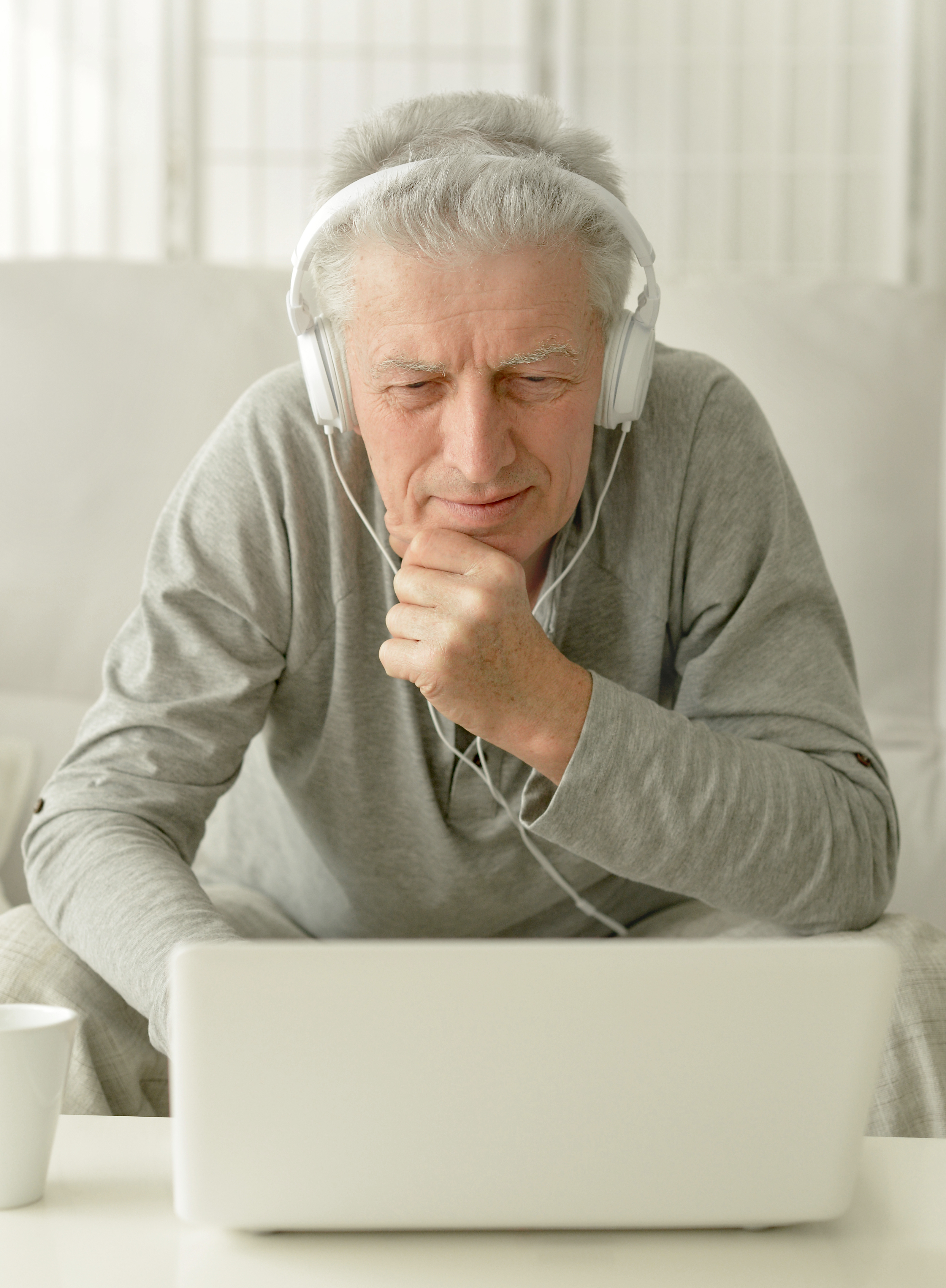 senior man using laptop at home